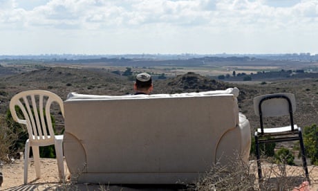Israeli watches Gaza bombing from hillside sofa