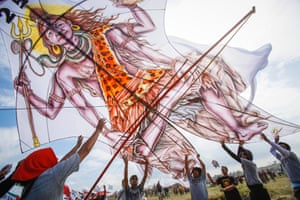 A traditional kite is readied for flight during the Bali Kite Festival in Sanur.