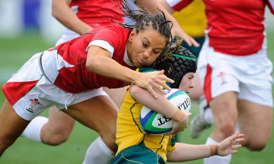 Wales full-back Non Evans, who is taking part in wrestling at the coming Commonwealth Games, tries to tackle Nicole Beck.