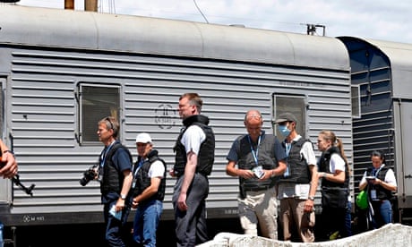 OSCE inspectors document the bodybags from MH17 at Torez train station