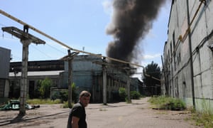 Smoke rises from a fire near the train station in Donetsk, where heavy fighting broke out Monday. ukraine