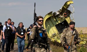 Rebels followed by members of the OSCE mission at plane wreckage ukraine mh17 malaysia
