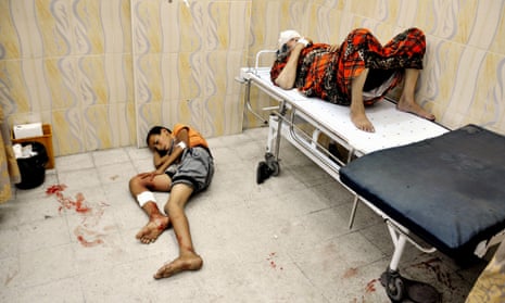 Palestinians sit at a hospital in the northern Gaza  Israel-Gaza conflict, Gaza Strip, Palestinian Territories - 24 Jul 2014.