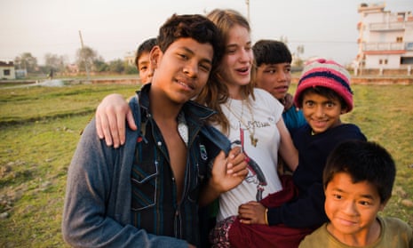 A volunteer with street children in Nepal 