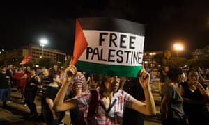 An Israeli left wing activist takes part in a demonstration against the Gaza war, in Tel Aviv, Israel.