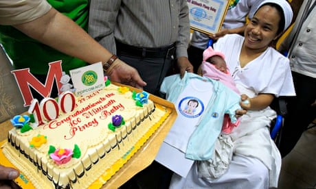 Dailin Duras Cabigayan, 27, smiles with Chonalyn – the 100 millionth baby born in the Philippines.