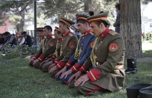 Kabul, Afghanistan: The presidential honour guard offer Eid al-Fitr prayers at the presidential palace.
