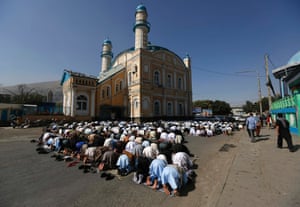 Kabul, Afghanistan: Afghans take part in morning prayers outside the Shah-e Doh Shamshira mosque.
