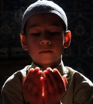 Mazar-i-Sharif, Afghanistan: A boy prays