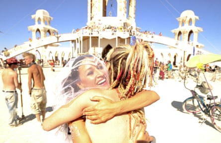 April Matulich and Crystal Rios celebrate after getting married at the 2011 Burning Man Festival.