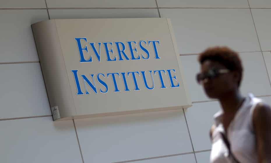 A person walking past an Everest Institute sign in a office building in Silver Spring, Md. Corinthian Colleges has agreed to close a dozen U.S. campuses in 11 states and place 85 up for sale. The company serves 72,000 students and owns Everest College, Heald College and WyoTech schools.  