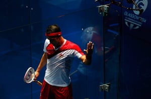 Squash TJ: Peter Barker of England wipes the sweat from his hand on the wall
