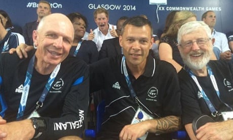 Prince Harry photobombs a picture with New Zealand sports officials. 
