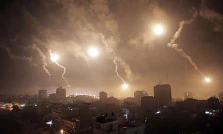 Israeli forces' flares light up the night sky of Gaza City early Tuesday