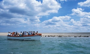 Tourists viewing seals from boat, Blakeney Point, Norfolk.