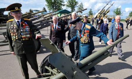 Visiting Russian World War II veterans, look at a WWII-era Soviet anti-tank gun at the site of the former Soviet Union's border fortifications outside Minsk on 2 July, 2014. Photograph: Viktor Drachev/AFP/Getty Images