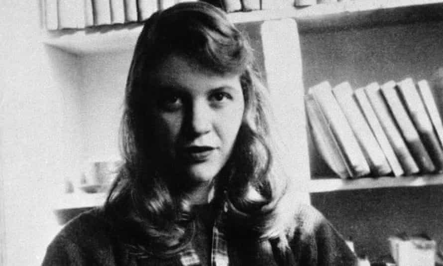 Author Sylvia Plath seated in front of a bookshelf