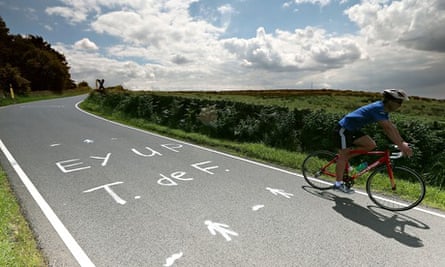The slogan 'Ey up T. de F.' painted on the road near Sheffield for the Tour de France