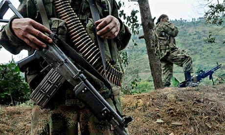 Members of the Farc patrol a road in Cauca province in Colombia
