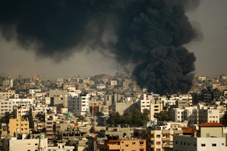 Smoke from Israeli strikes on the market Shojae'ya rises over Gaza City, Wednesday, July 30, 2014.