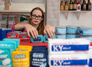Sparrow arranges her shelves of felt products