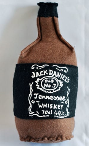 A bottle of Jack Daniel's whiskey made from brown and black felt