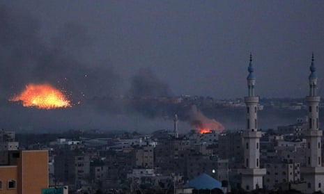 Smoke rises after Israeli shelling in Al Shejaeiya neighbourhood during a military operation in the east of Gaza City, 30 July 2014.