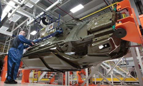 An assembly line worker works on a 2015 Chrysler 200 automobile at the Sterling Heights Assembly Plant in Sterling Heights, Mich. 