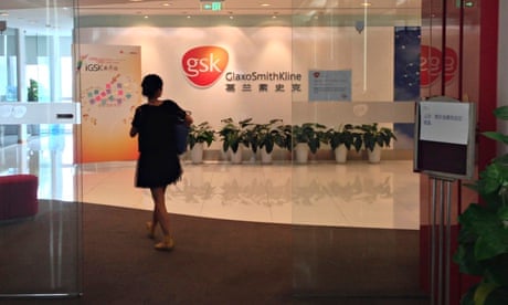 A Chinese employee walks into a GSK office
