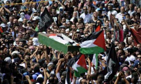 Palestinians carry the body of Mohammed Abu Khdeir through Jerusalem