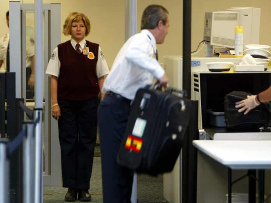 Transportation Security Administration screeners check passengers as they prepare to board flights. tsa