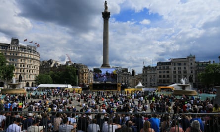 Crowds in Trafalgar Square gather to watch stage three of the Tour de France.