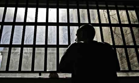 Man looks out of prison window