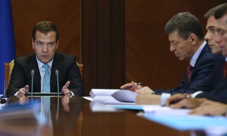 Russia's Prime Minister Dmitry Medvedev (L) chairs a meeting on Crimea at the Gorki state residence outside Moscow, on 8 July, 2014. Photograph: RIA Novosti/Reuters