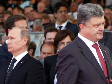 Ukraine's President (then President-elect) Petro Poroshenko, right, walks past Vladimir Putin during the commemoration of the 70th anniversary of D-Day in France, on 6 June, 2014. Photograph: Christophe Ena/AP
