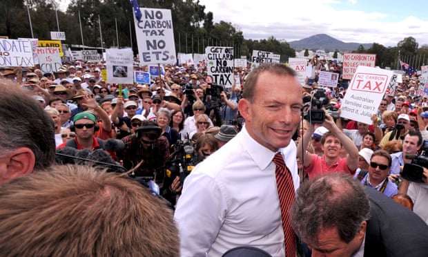 Opposition leader Tony Abbott leaving an anti-carbon tax rally in Canberra in 2011