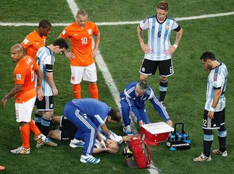 Javier Mascherano receives medical treatment.