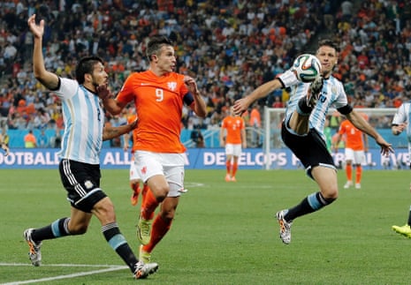 Argentina's Martin Demichelis cuts out a rare threat in the first half.