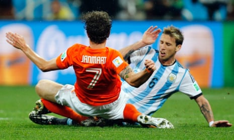 Netherlands' Daryl Janmaat, left, collides with Argentina's Lucas Biglia in a game heavy on tackles and poor on quality.