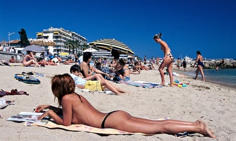 Sunbathers on Plage du Midi, Cannes Cote d'Azur, France