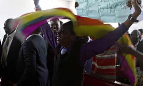 Members of Uganda's gay community reacts as the anti-gay law is declared null and void