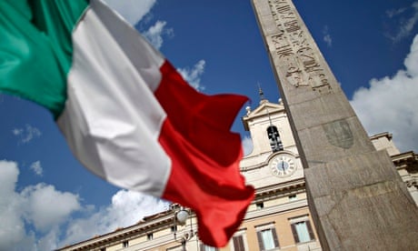 An Italian flag waves in front of the Montecitorio palace