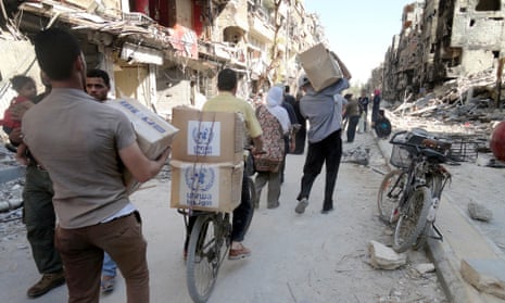 The United Nations Relief and Works Agency for Palestine refugees in the near east (UNRWA) provide food assitance for Palestinian refugee camp of Yarmouk in Damascus, Syria on July 8, 2014.