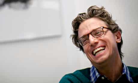 BuzzFeed's Founder and CEO Peretti reacts during an interview in New York