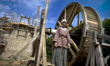 A worker poses construction site of the "Guedelon Castle", an entirely new medieval castle built with 13th century techniques, in Treigny, central France. 