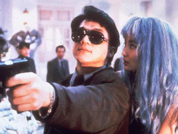 Jackie Chan as Boomer and Maggie Cheung as Barbara in Twin Dragons.