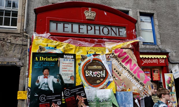 Edinburgh fringe flyers plastered on phone box