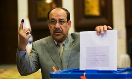 raqi Prime Minister Nouri al-Maliki casts his vote at a polling station in the green zone on April 30, 2014 in Baghdad.