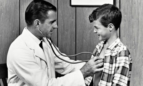 Doctor examining a boy with a stethoscope