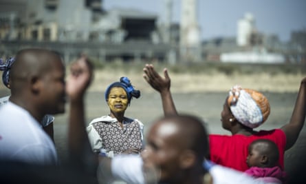 South African women take part in a gathering to support women who lost bread winners during the violent strikes of August 2012.